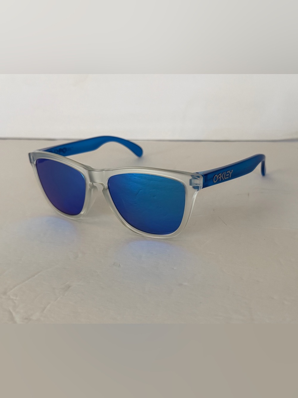 Oakley Translucent Frame Sunglasses with Blue Lenses